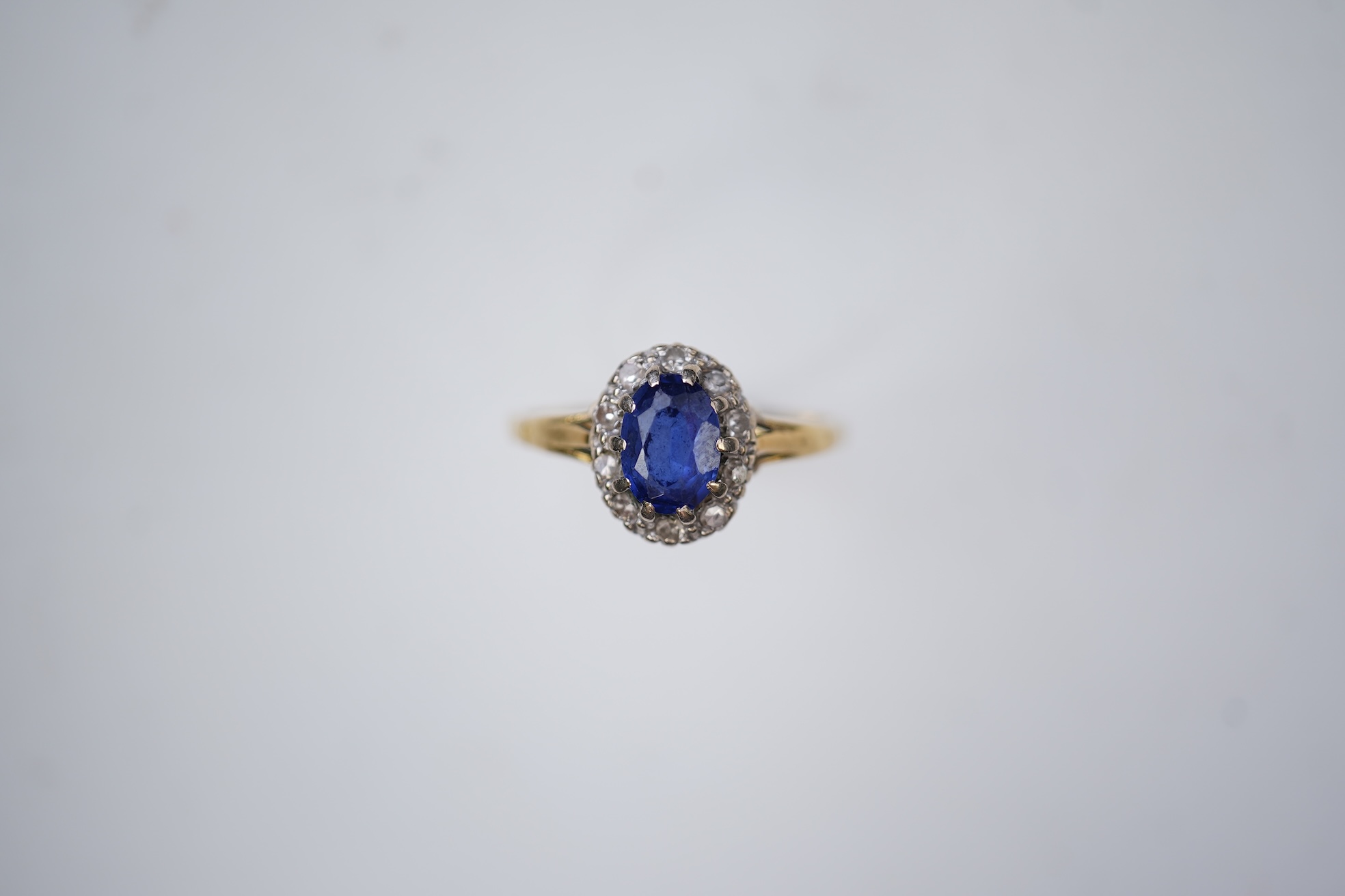 A synthetic sapphire and diamond cluster ring, mid 20th century